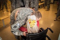 Maj. Randall Stillinger A Soldier from the 1-112th Cavalry Regiment, 72nd Infantry Brigade Combat Team, receives a hug from Elizabeth Laird before boarding a plane at Robert Gray Army Airfield on Sep. 13, 2015. Laird is commonly known as “The Hug Lady” and is at Fort Hood for almost every arriving and departing flight. The 1-112th deployed to Egypt as part of the Multinational Force and Observers mission, which enforces the 1979 treaty between Israel and Egypt. (36th Infantry Division photo by Maj. Randy Stillinger)